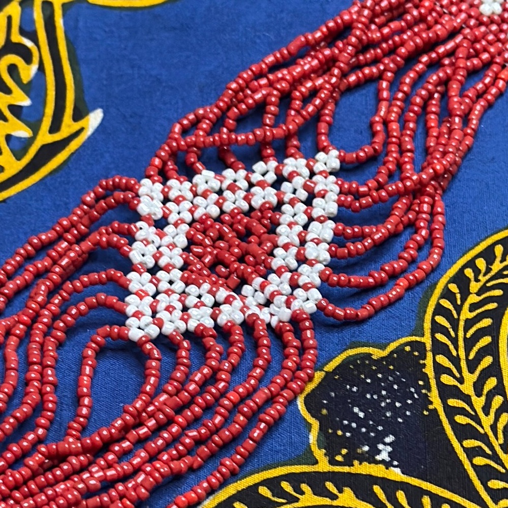 Red and White Beaded Bracelet with Geometric Centerpiece